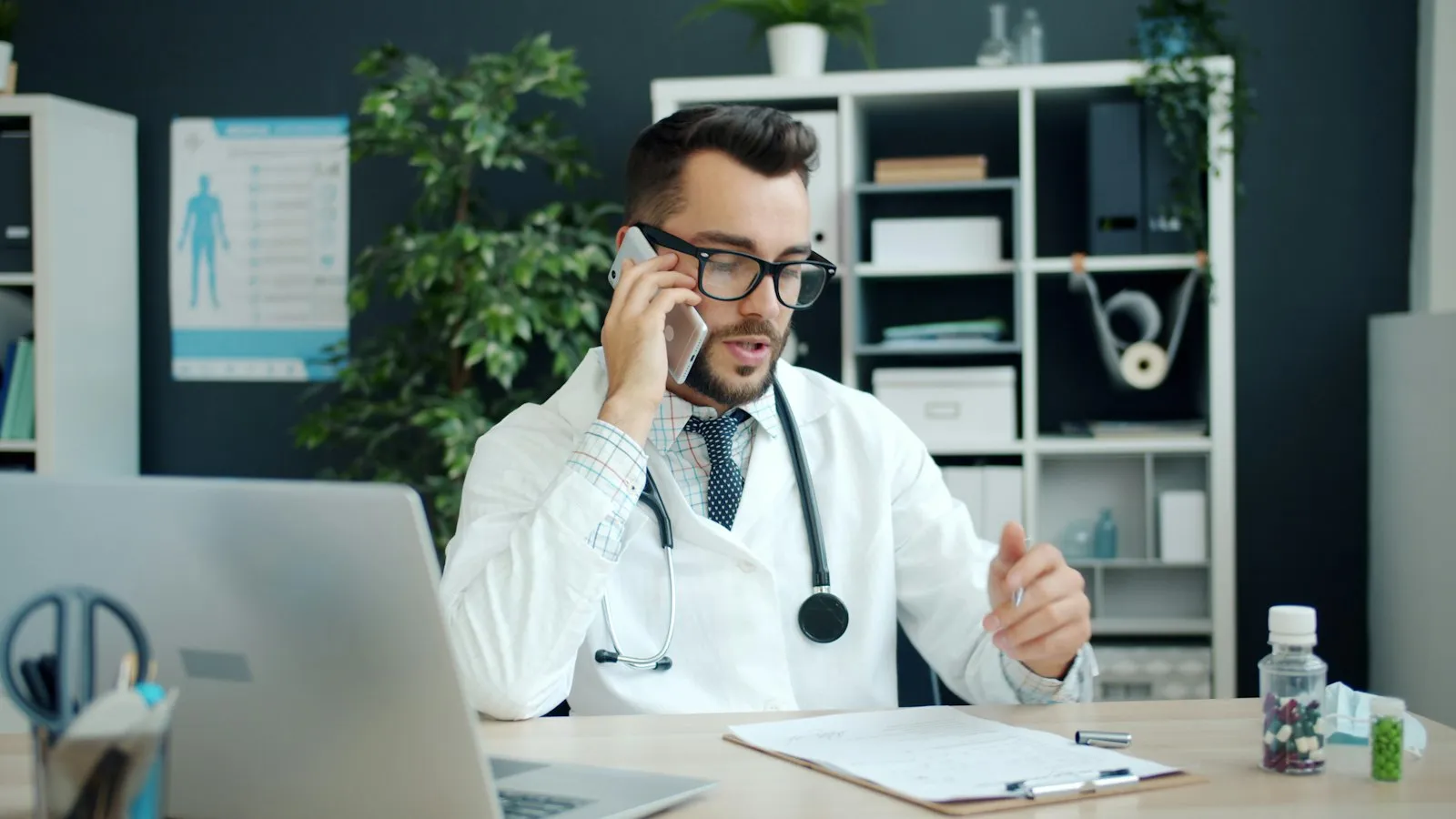 Prescriber on a follow-up phone call in a clinic office