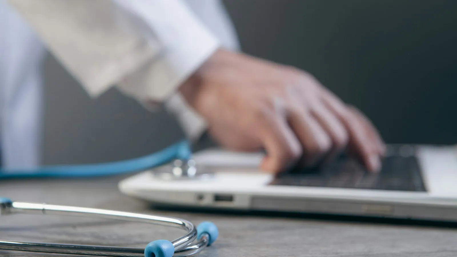 Clinician typing on a laptop while reviewing CPT results