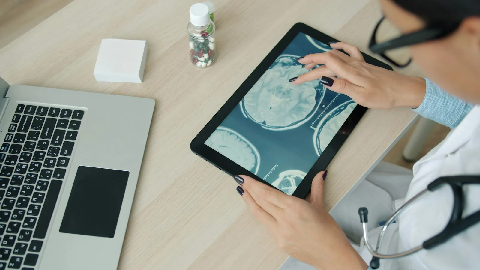 Clinician reviewing assessment results on a tablet at a clinic desk