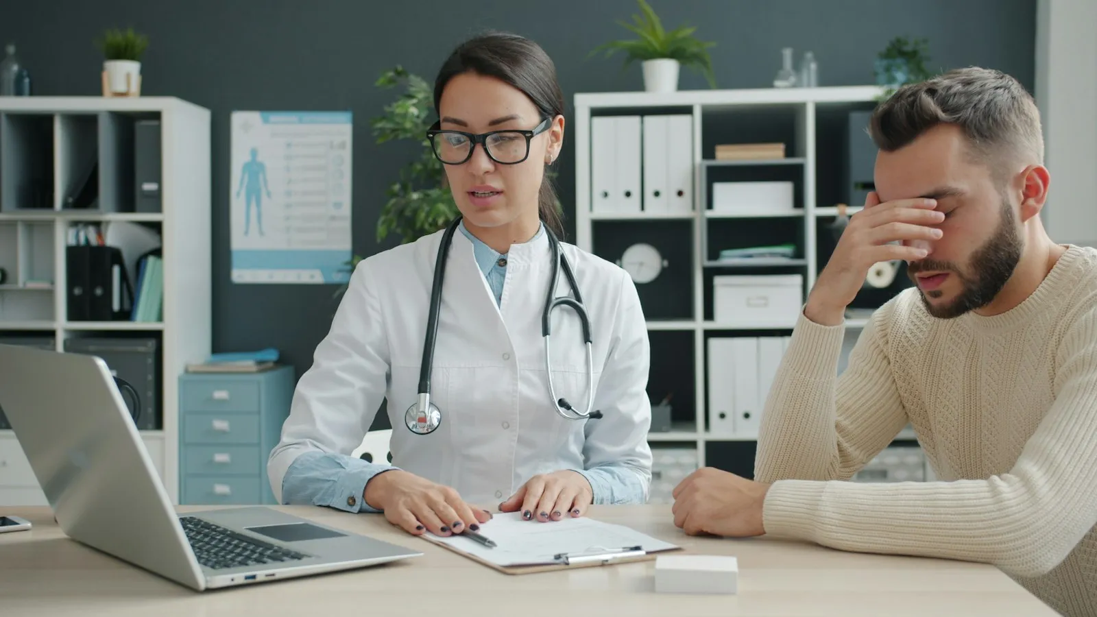 Clinician talking with an adult patient during an ADHD evaluation